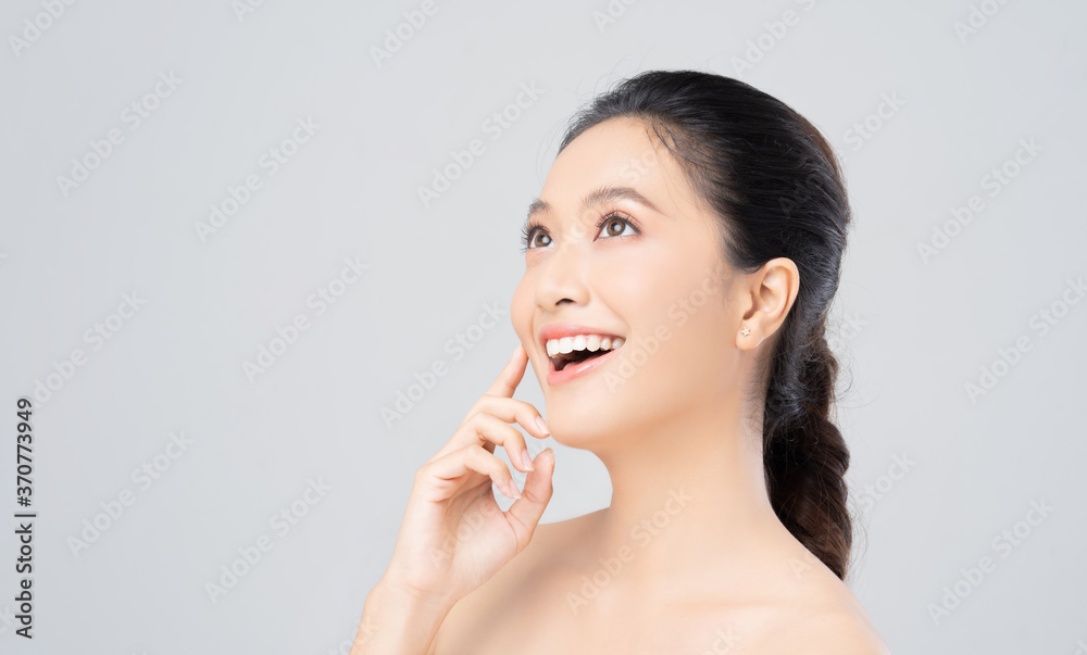 Beautiful female asian face with natural perfect skin in studio portrait Beautiful female asian face with natural perfect skin in studio portrait