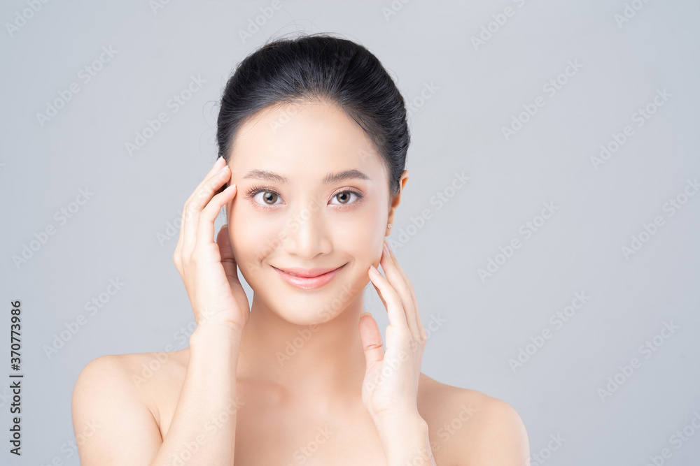 Beautiful female asian face with natural perfect skin in studio portrait Beautiful female asian face with natural perfect skin in studio portrait
