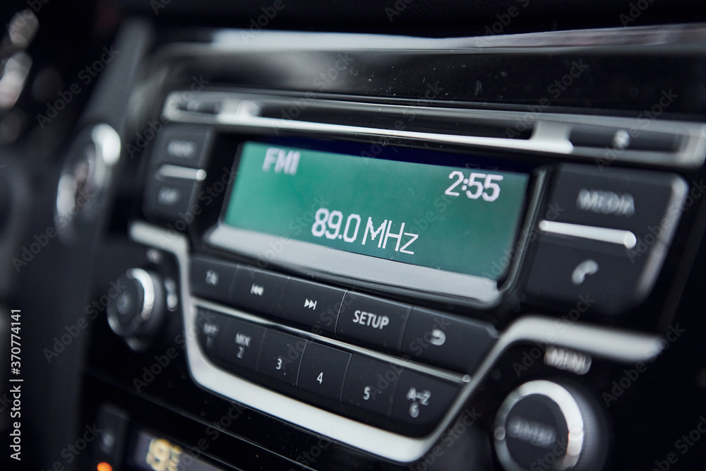 Radio panel. Modern new luxury automobile interior. Design and technology Radio panel. Modern new luxury automobile interior. Design and technology