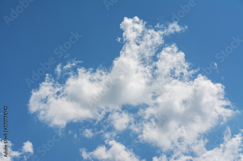 White clouds in the blue sky.