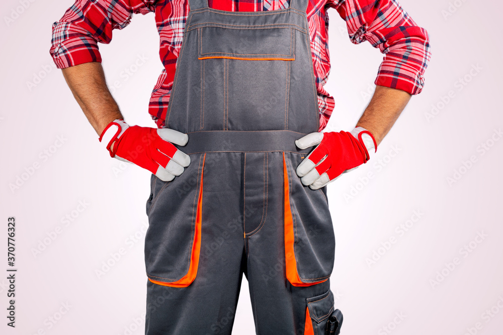 Worker on strike against grey background. Concept Angry Worker. Worker on strike against grey background. Concept Angry Worker.
