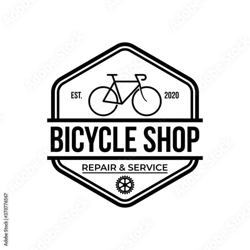 bike shop logo badge and label. Old style bike shop and repair type logo vector