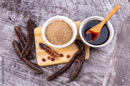 Carob molasses and carob po...