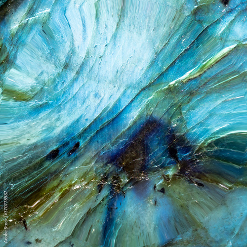 Macro photo of a colorful and textured labradorite stone. photo