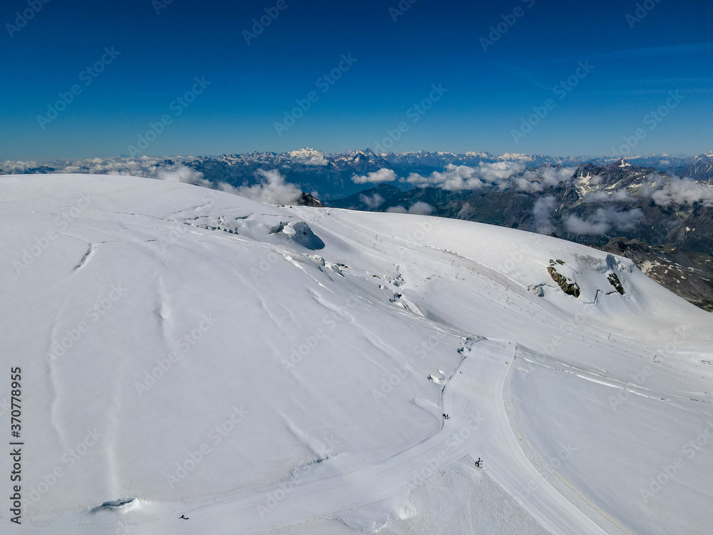 Ski slopes on mount small Matterhorn over Zermatt in the Swiss alps