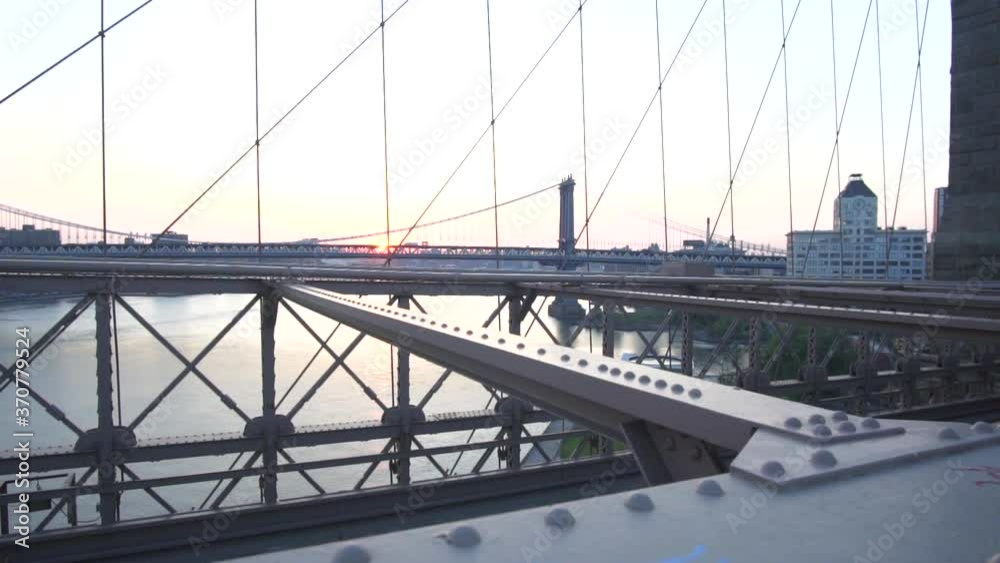On Brooklyn Bridge looking into East River No People with Cars, Traffic passing the Bridge Summer, Sunrise On Brooklyn Bridge looking into East River No People with Cars, Traffic passing the Bridge Summer, Sunrise