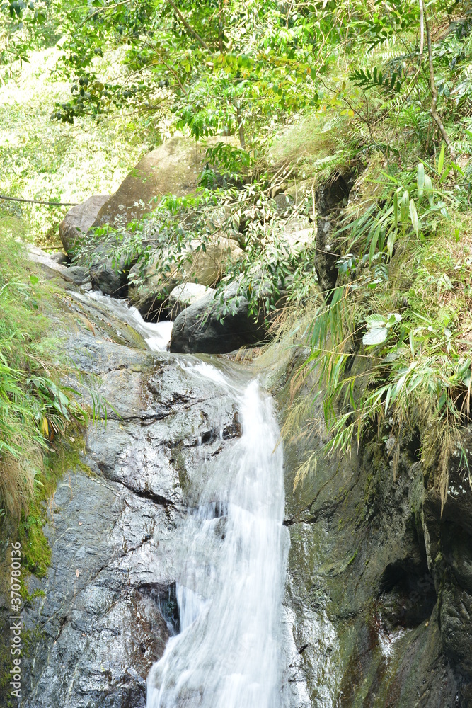 Tanawan water falls with big rocks and green leaves Tanawan water falls with big rocks and green leaves