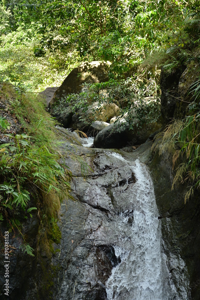 Tanawan water falls with big rocks and green leaves Tanawan water falls with big rocks and green leaves