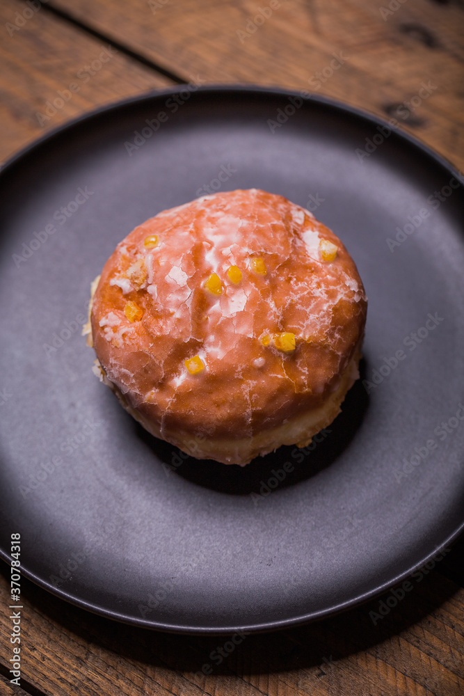 Traditional Polish donuts on wooden background. Tasty doughnuts with jam Traditional Polish donuts on wooden background. Tasty doughnuts with jam