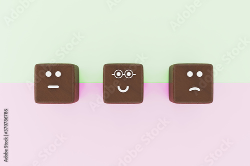 3D illustration of 3 cube shape face emoticons for a survey. Marketing and client satisfation concept. photo