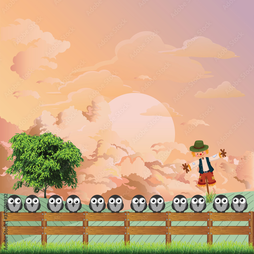 Naklejka premium Apprehensive flock of birds perched on a fence deterred from feeding on farmers land by a scarecrow set against a dawn or dusk sky 