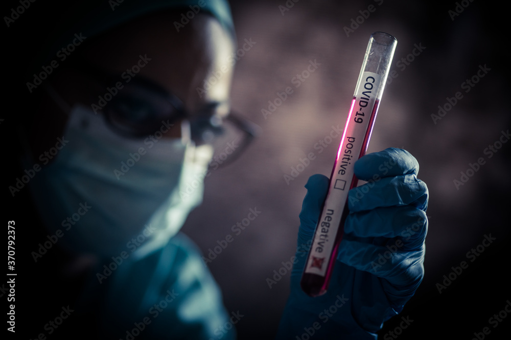Doctor hands holding a coronavirus COVID-19 negative test tube Doctor hands holding a coronavirus COVID-19 negative test tube