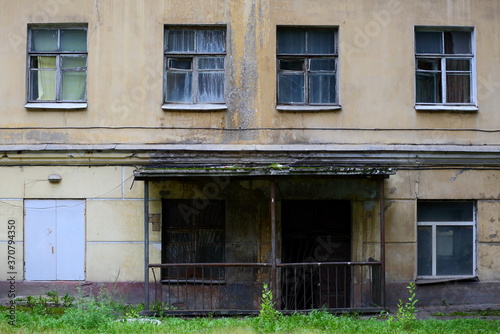 Facade of an old abandoned house on the eve of breaking, 13 Utkin prospekt, Saint Petersburg, Russia, August 2020
