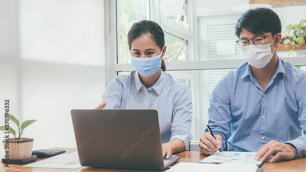 Asian People Successful Teamwork Business Wearing Medical Mask and Working. Work from Private Office Social Distancing among Coronavirus Outbreak Situation Asian People Successful Teamwork Business Wearing Medical Mask and Working. Work from Private Office Social Distancing among Coronavirus Outbreak Situation