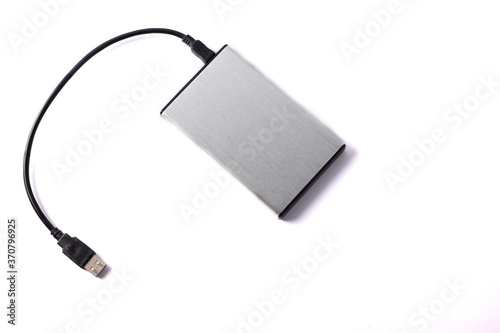Gray external hard disk with black USB cable on white background.