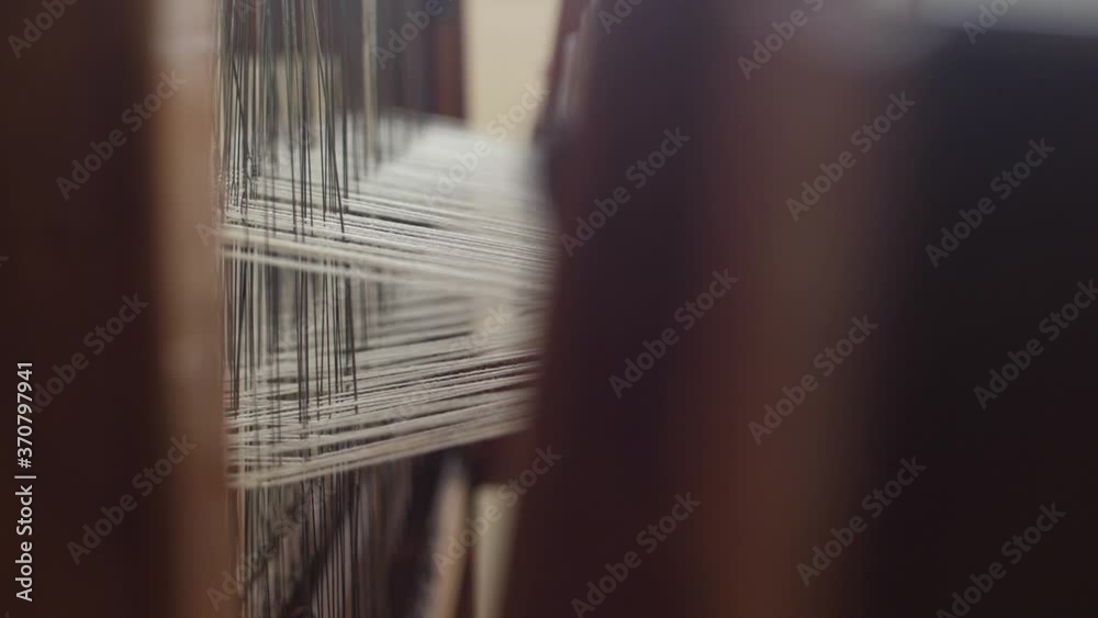 making traditional tapestry on a wooden weaving loom slow motion making traditional tapestry on a wooden weaving loom slow motion