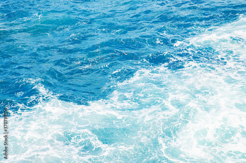 Natural background blue sea with waves, azure clear water beach