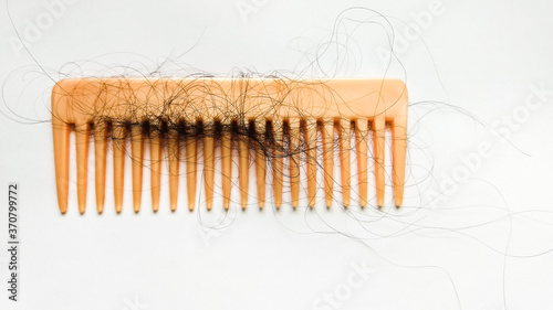 Hair tangled in comb.