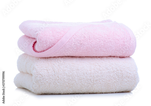 Stack folded towels pink white on white background isolation