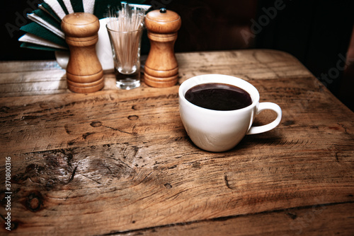 a cup of coffee, on the table
