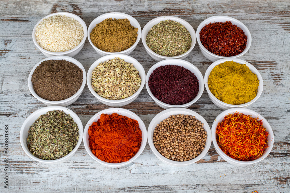Colorful spices and herbs isolated on cooking background and design Colorful spices and herbs isolated on cooking background and design