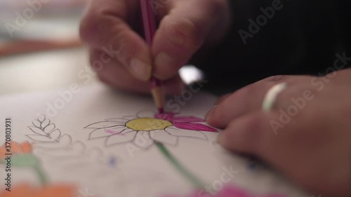 elderly man in rehabilitation occupational therapy painting slow motion photo