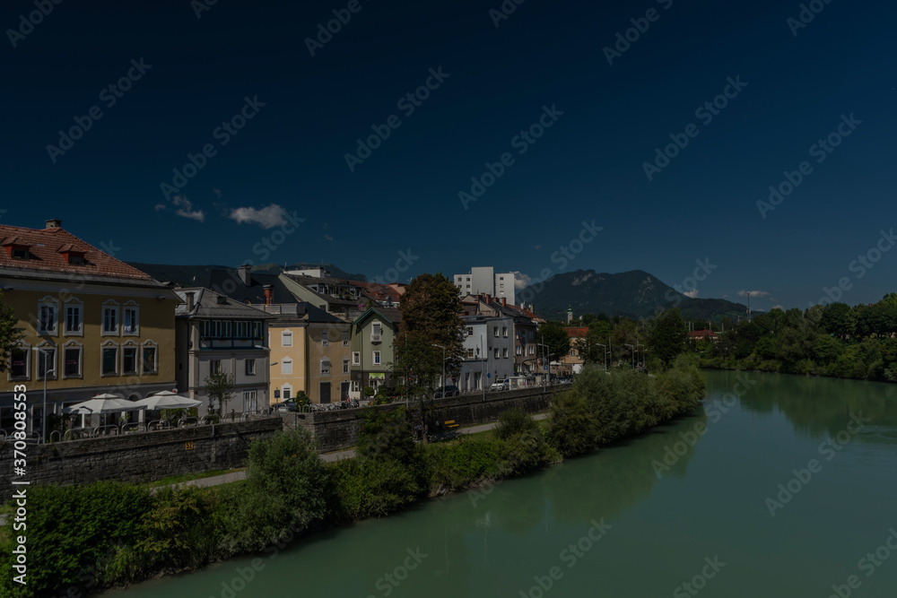 River Drau in Villach town in south Austria in hot summer sunny morning River Drau in Villach town in south Austria in hot summer sunny morning