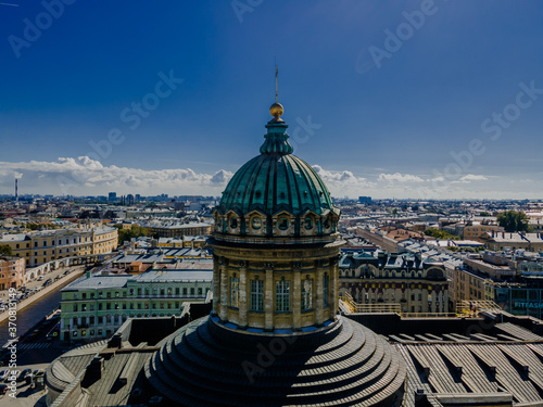 Aerial view of the Kazan Cathedral on a clear summer day, the copper dome, gold cross, columns, Nevsky Prospekt, the singer's house, Griboyedov Canal, Herzen University