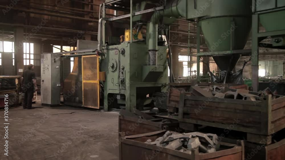 A View of an inside of an old school foundry, factory, almost steam punk look like