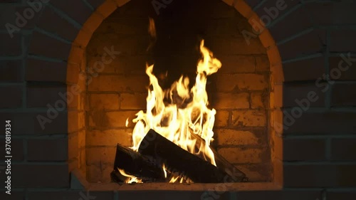 wood burning in the fireplace and there is smoke coming