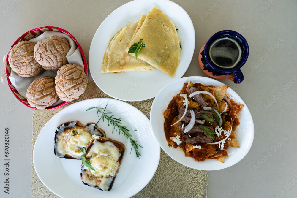 Delicious mexican breakfast dishes, chilaquiles, crepes and egg toast Delicious mexican breakfast dishes, chilaquiles, crepes and egg toast