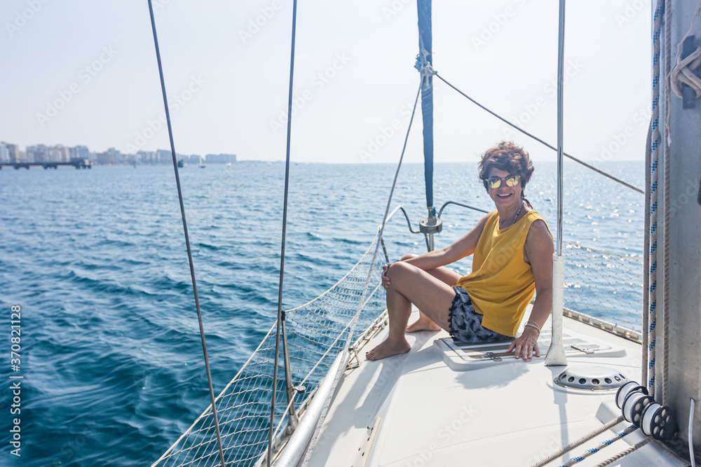 Woman on the bow of a boat