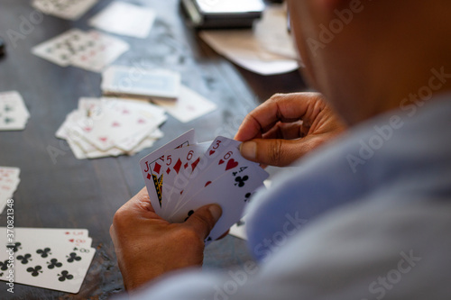 Medellin, Antioquia / Colombia. September 17, 2019. People playing card game card (Detail)