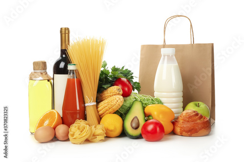 Paper bag and different food isolated on white background
