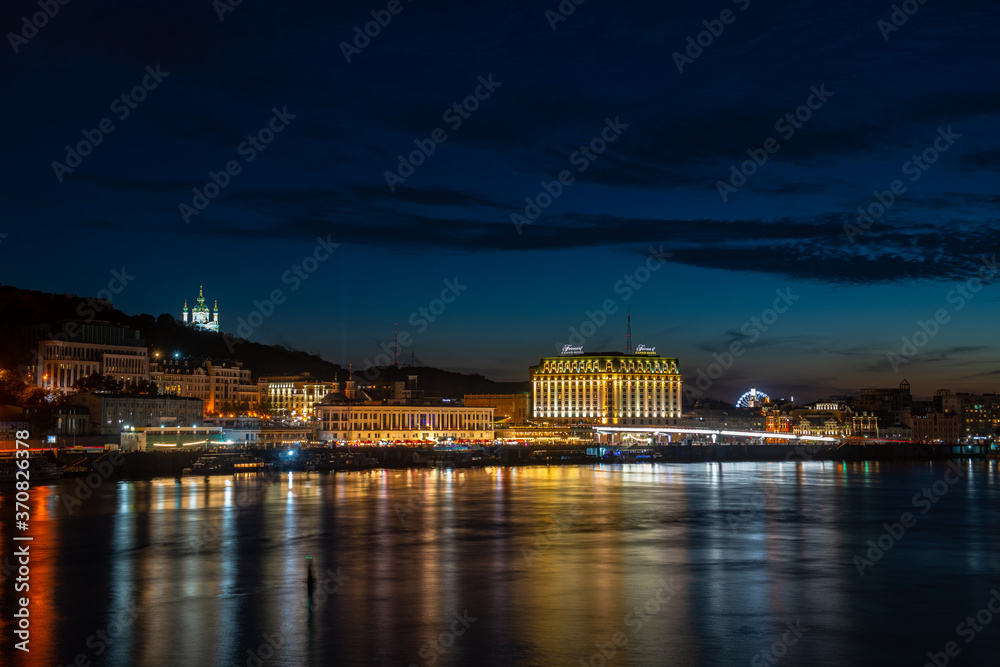 Nice right cost of Dnipro river Kiev evening landscape panorama in Ukraine at blue hour august 2020
