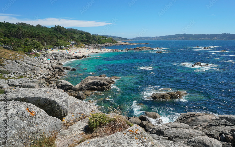 Spain, Galicia, rocky coast with beach in summer, Atlantic ocean, Bueu, province of Pontevedra, Praia de Lagos