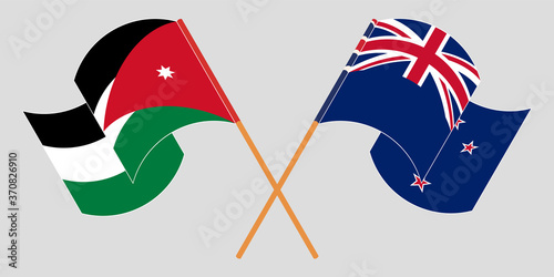 Crossed and waving flags of Jordan and New Zealand