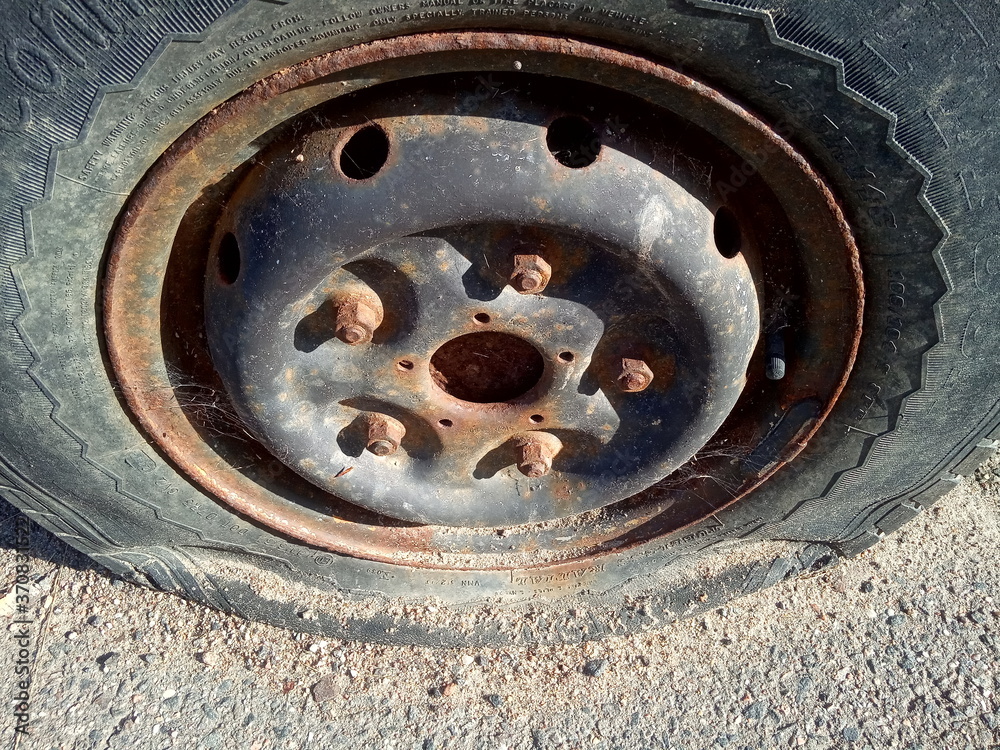 flat tire and rusty car, old car elements

