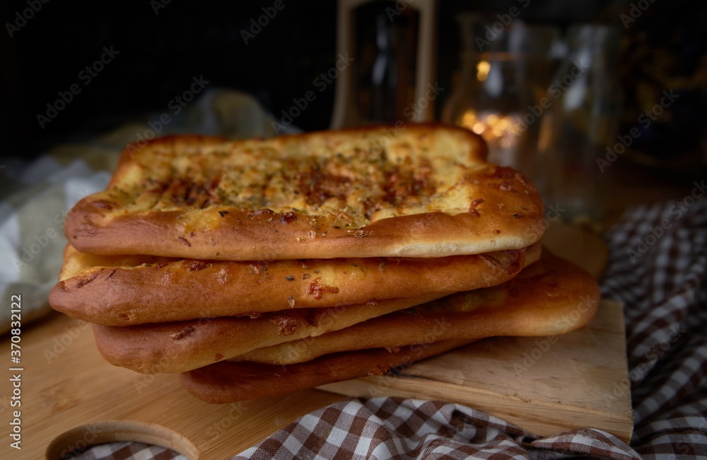 Stacking of spicy naan bread on table Stacking of spicy naan bread on table