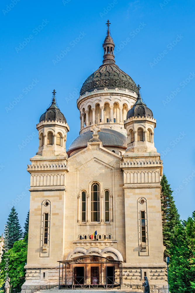 Fototapeta premium The orthodox cathedral in Cluj Napoca, Transylvania, Romania. Cathedral of the Dormition of the Theotokos or Dormition of the Mother of God built in Brancovenesc style on the Avram Iancu Square