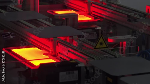 Infrared Soldering and Tabbing Process Connecting Silicon Solar Cells on Automated Photovoltaic Production Line in Modern Factory