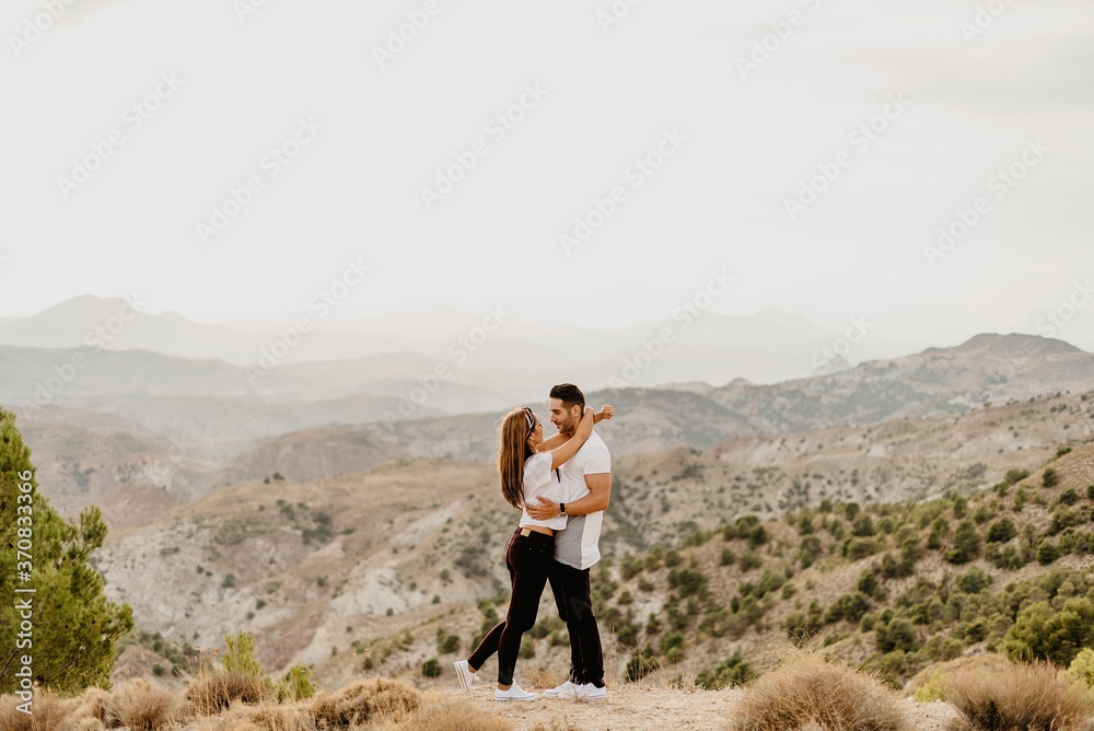 Young couple in love enjoying in mountains Young couple in love enjoying in mountains