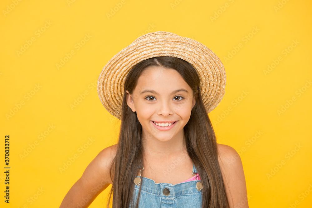 Stunning girl in elegant hat. Cheerful face. Emotional child. Summer holidays. Fashionably dressed. Enjoying vacation. Fancy outfit. Summer fashion. Happy cheerful kid in summer hat yellow background Stunning girl in elegant hat. Cheerful face. Emotional child. Summer holidays. Fashionably dressed. Enjoying vacation. Fancy outfit. Summer fashion. Happy cheerful kid in summer hat yellow background