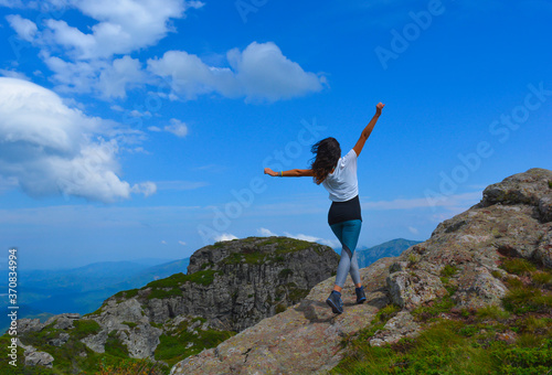 Woman on the top of mountain