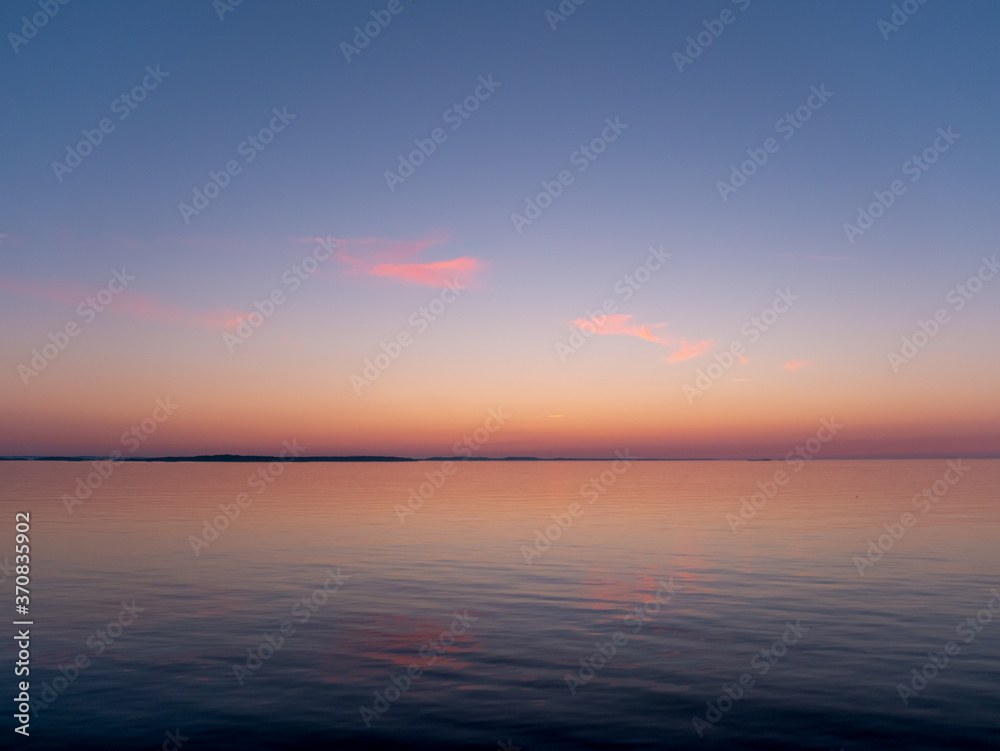 Sunrise seascape. View of the Baltic Sea during the White Nights.