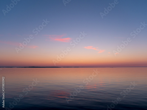 Sunrise seascape. View of the Baltic Sea during the White Nights. © Petr