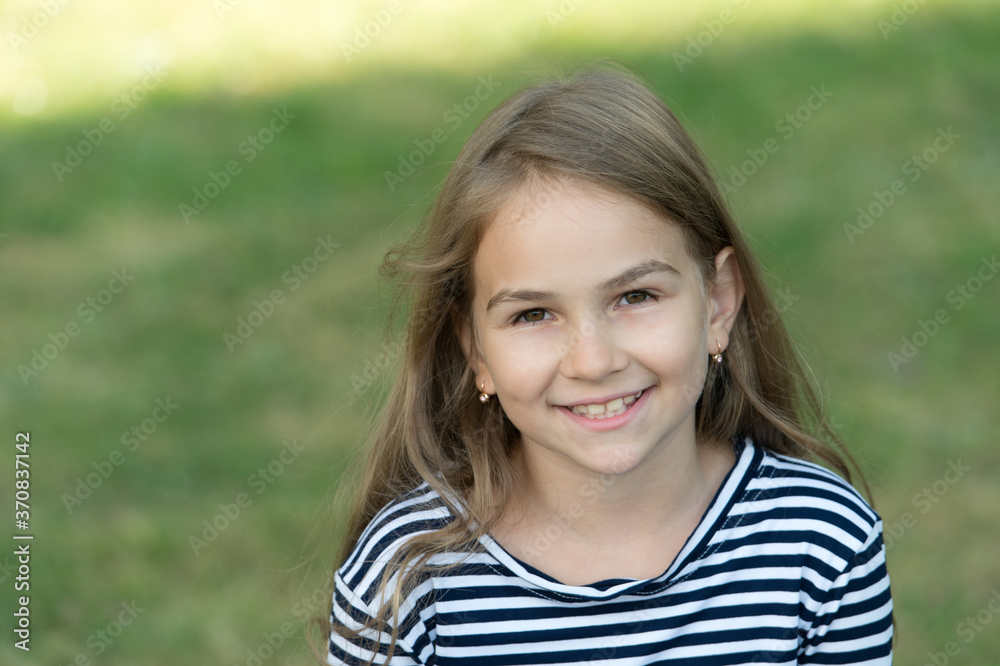 Smile that makes lasting impression. Happy child smile summer outdoors. Dental health. Oral hygiene. Cavities and teeth decay prevention. Dental fillings. Pediatric dentistry, copy space Smile that makes lasting impression. Happy child smile summer outdoors. Dental health. Oral hygiene. Cavities and teeth decay prevention. Dental fillings. Pediatric dentistry, copy space
