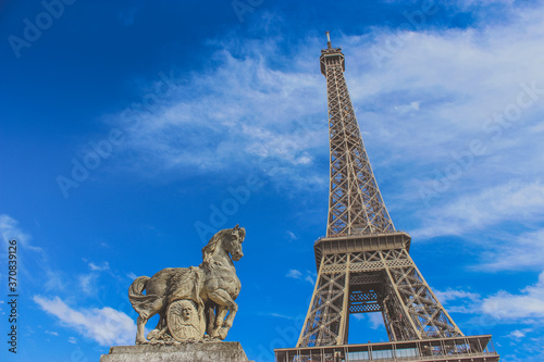 The Eiffel tower in Paris, France with the horse statue, vintage style