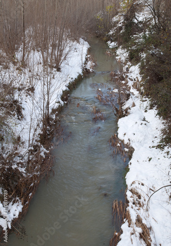 Gallego River with its snow-covered banks. Sabiñanigo. Huesca. Aragon. Spain. photo