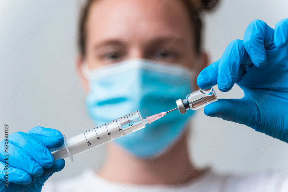 Medical worker preparing vaccine for corona-virus, cure for virus disease Medical worker preparing vaccine for corona-virus, cure for virus disease